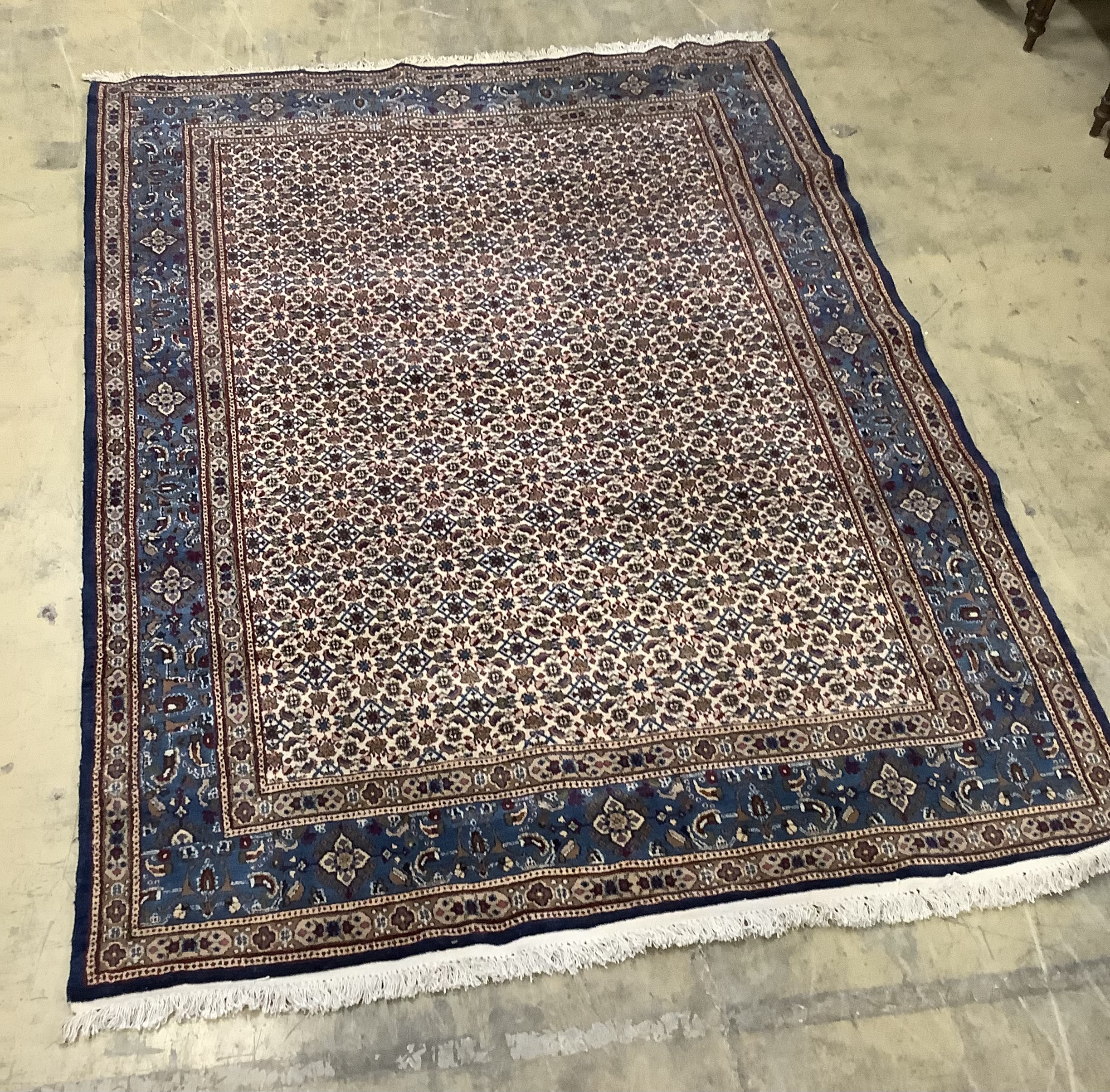 A North West Persian ivory ground carpet, 275 x 210cm